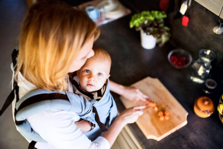 young-mother-with-a-baby-boy-doing-housework-2022-03-30-20-23-32-utc